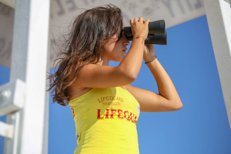 Lifeguard using binoculars